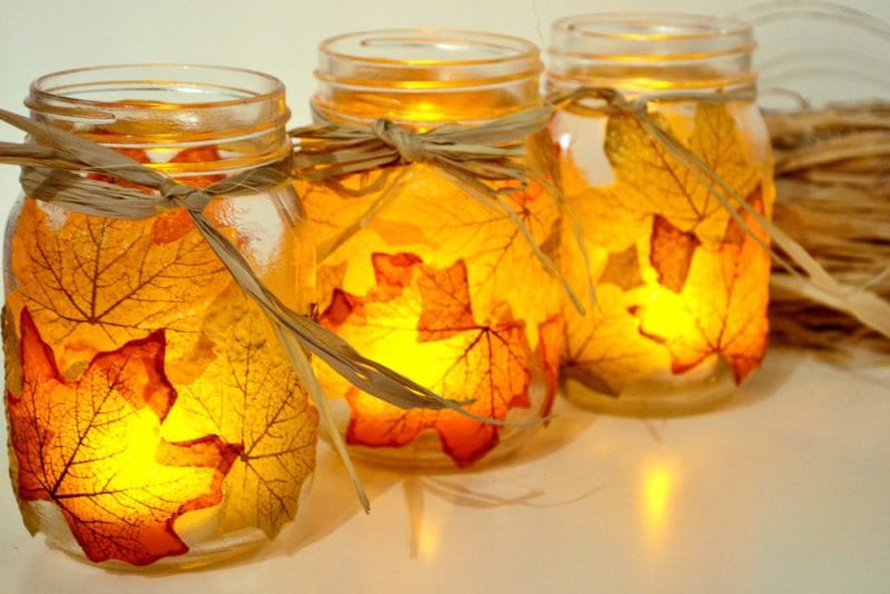 Glowing lanterns made from mason jars and leaves