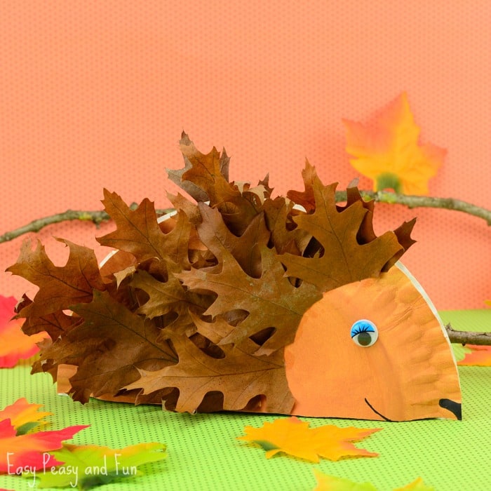 A hedgehog made from a folded paper plate and leaves