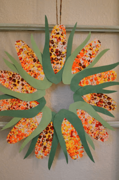 Colorful paper ears of corn circle up to make a cute wreath