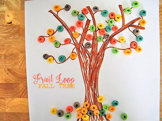 A colorful fall tree made from Fruit Loops glued to a drawing of a tree