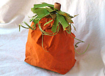 An orange pumpkin made from a paper bag