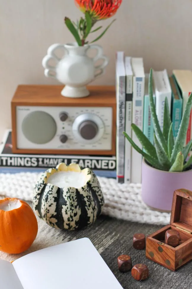 Tiny pumpkins with the centers cut out and filled with tea light candles