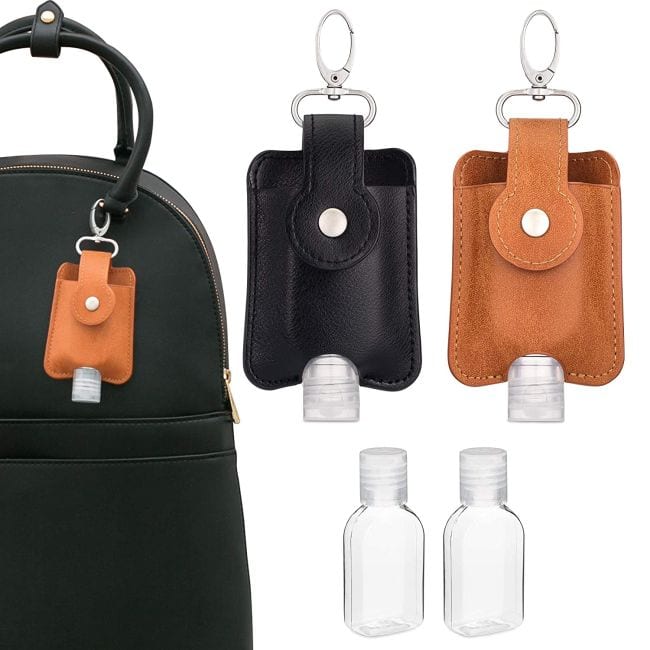 Leather hand sanitizer holders in black and brown with refillable bottles and clips