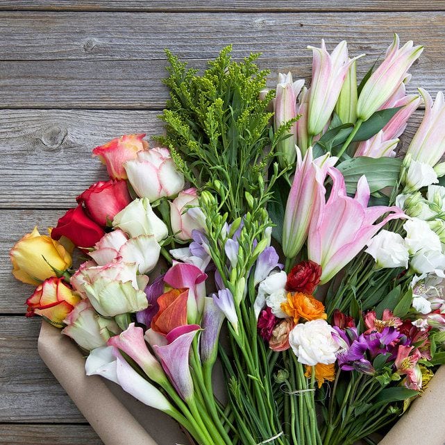 bouquet of Bouqs assorted, colorful farm-fresh flowers on a table, as an example of teacher appreciation gifts- teacher gifts