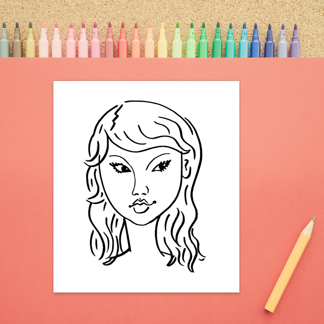 A drawing of a woman's face is shown in black marker on a white background. There are almond shaped eyes, a nose, a mouth, eyebrows, and long wavy hair.