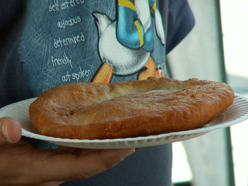 Woman holding frybread.