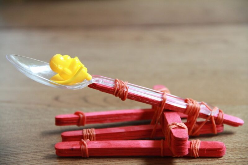 A simple catapult built from popsicle sticks and rubber bands