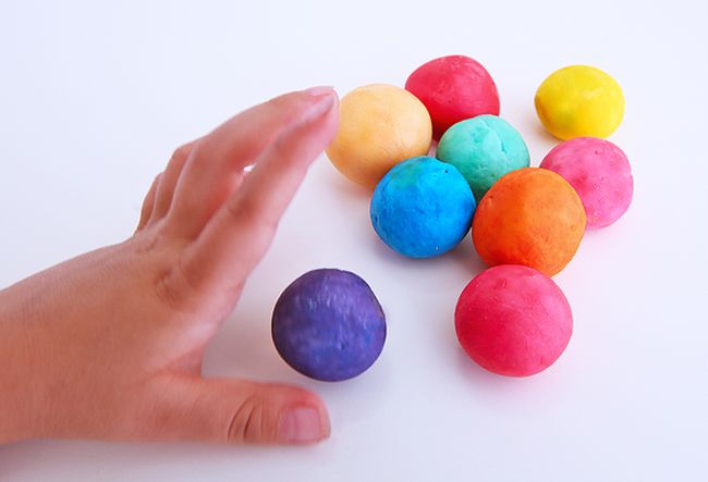 Student playing with homemade colorful bouncy balls 5th grade science