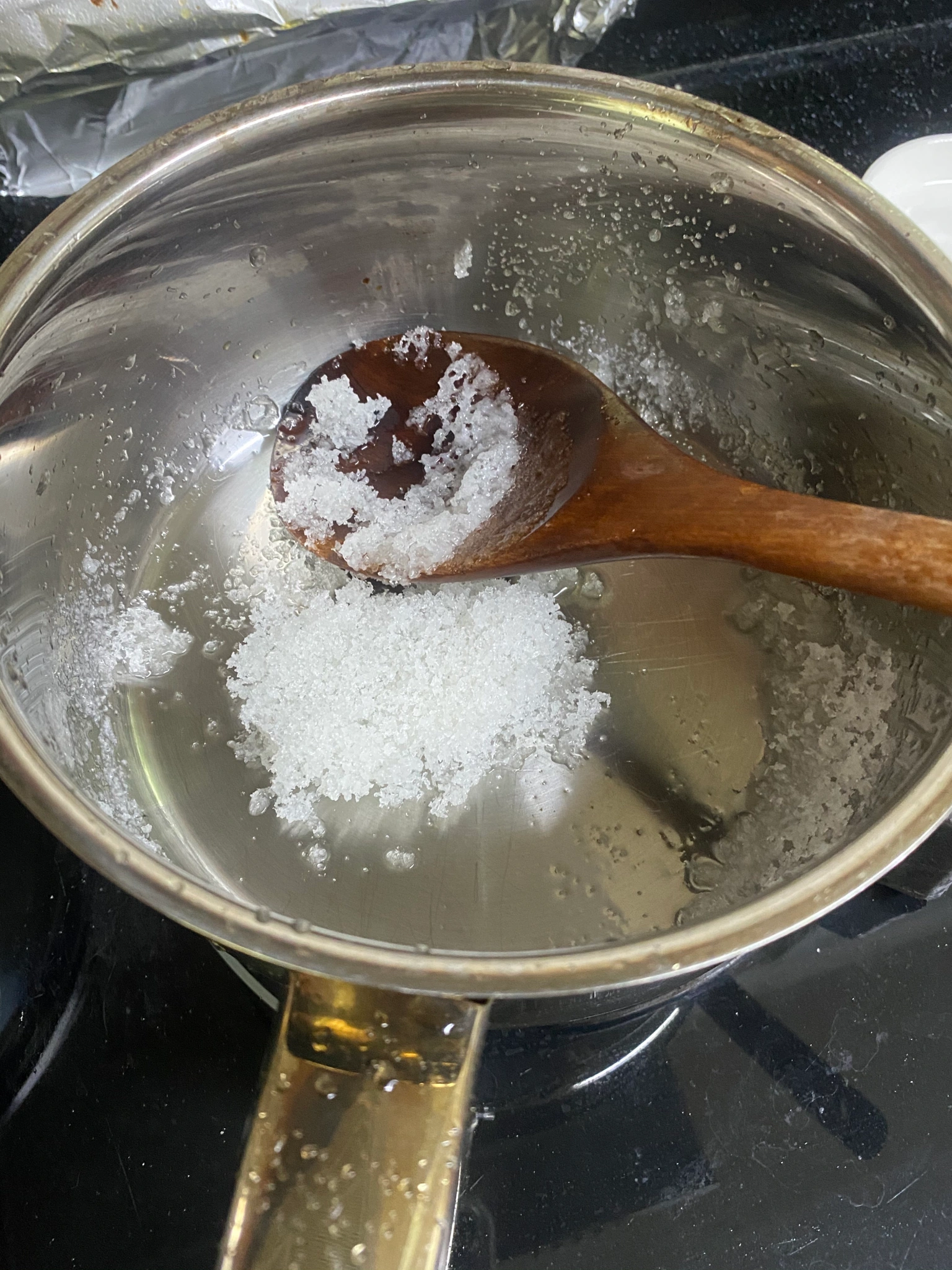 pot with sugar poured in it for high school science experiments