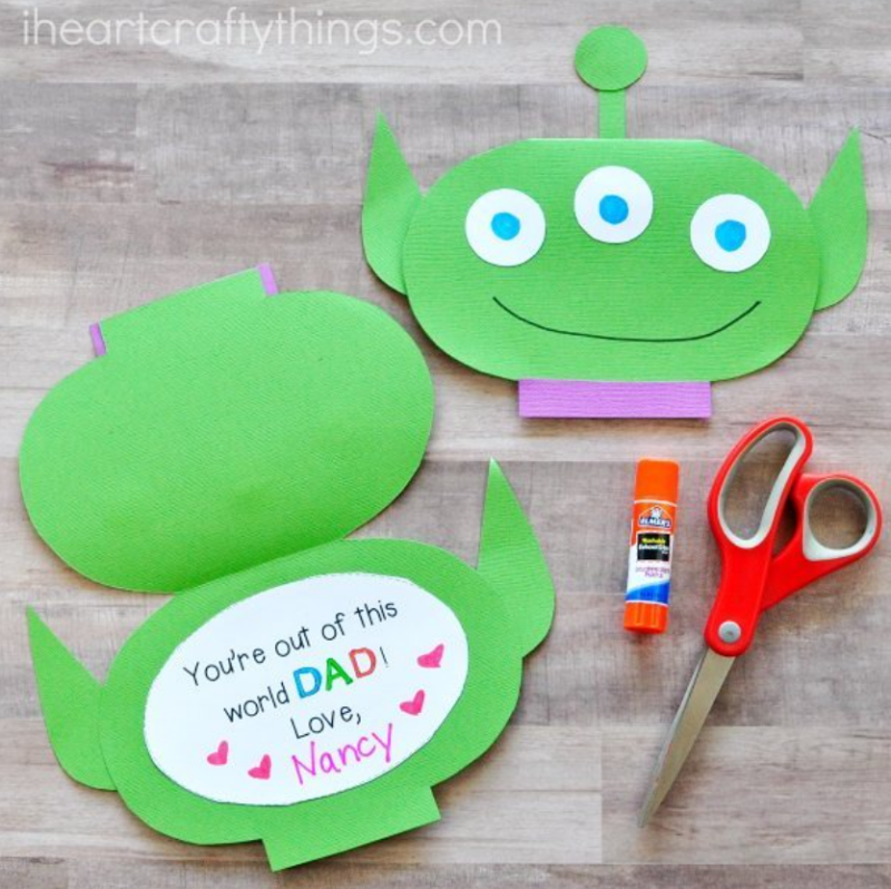 A little alien is made into a card out of construction paper