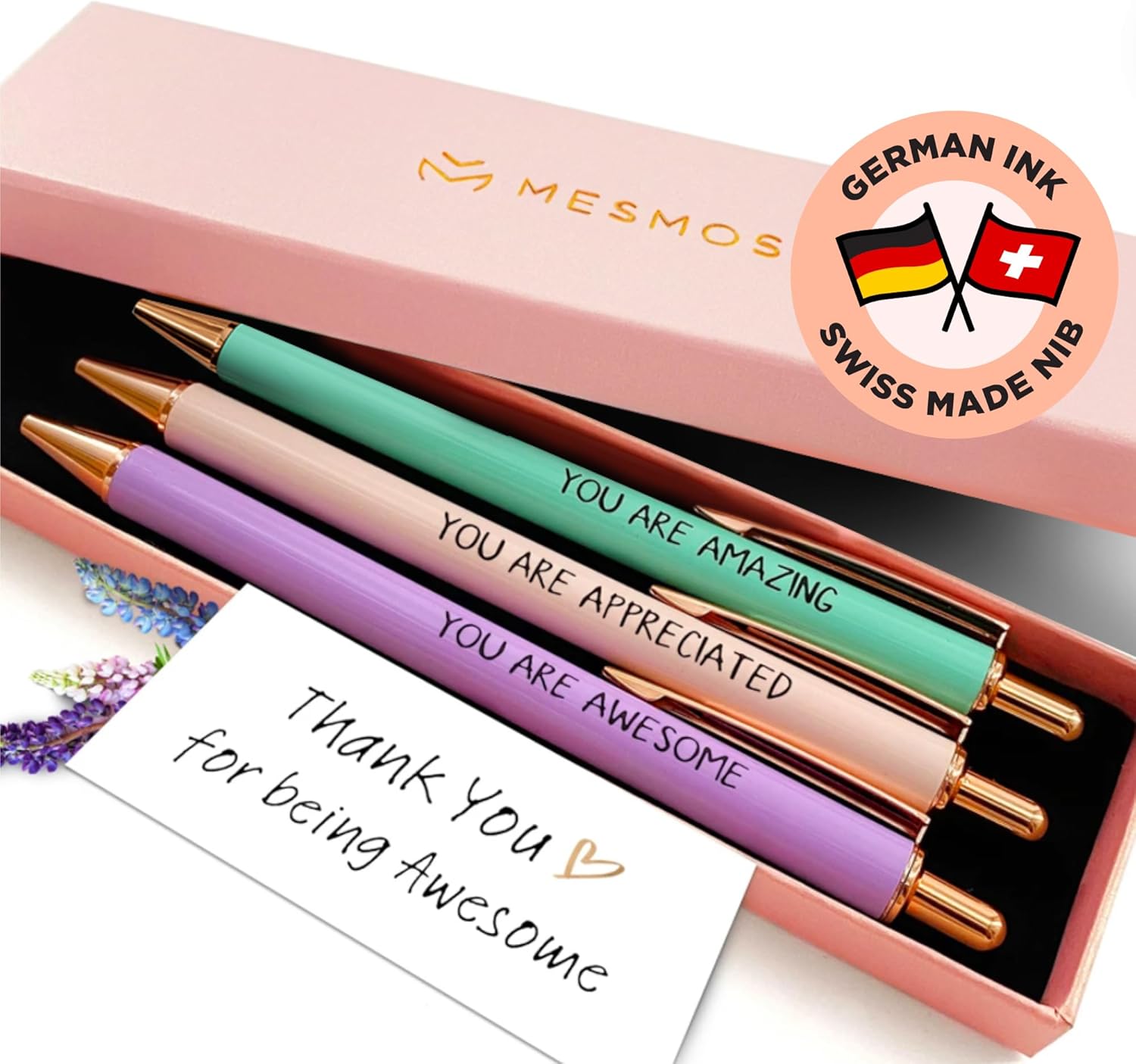 Set of pastel-colored pens with inspirational messages in a pink gift box
