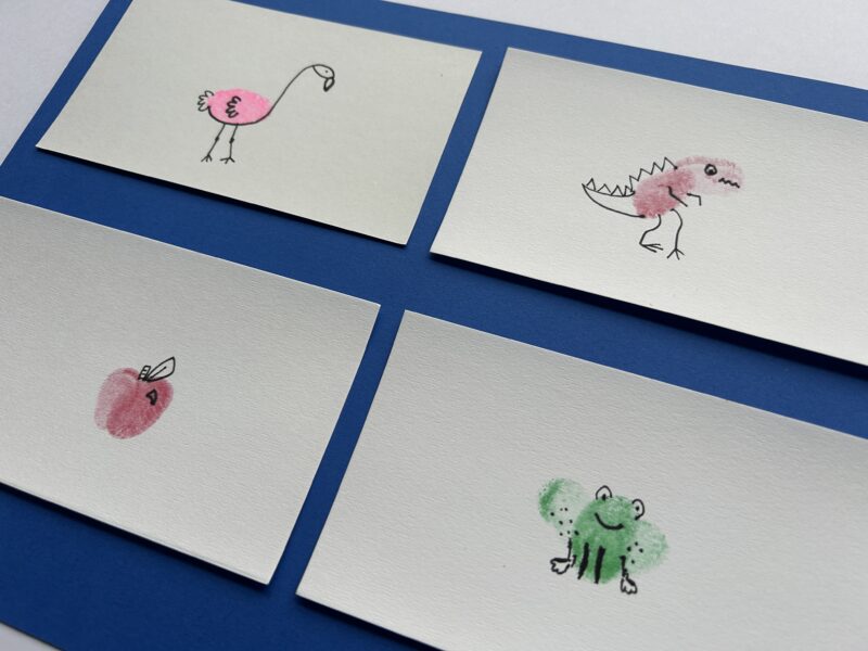 Small sheets of paper with animals fingerprint art