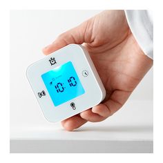 Timer Ikea classroom ideas: A hand is shown holding a small white square timer/clock/thermometer.