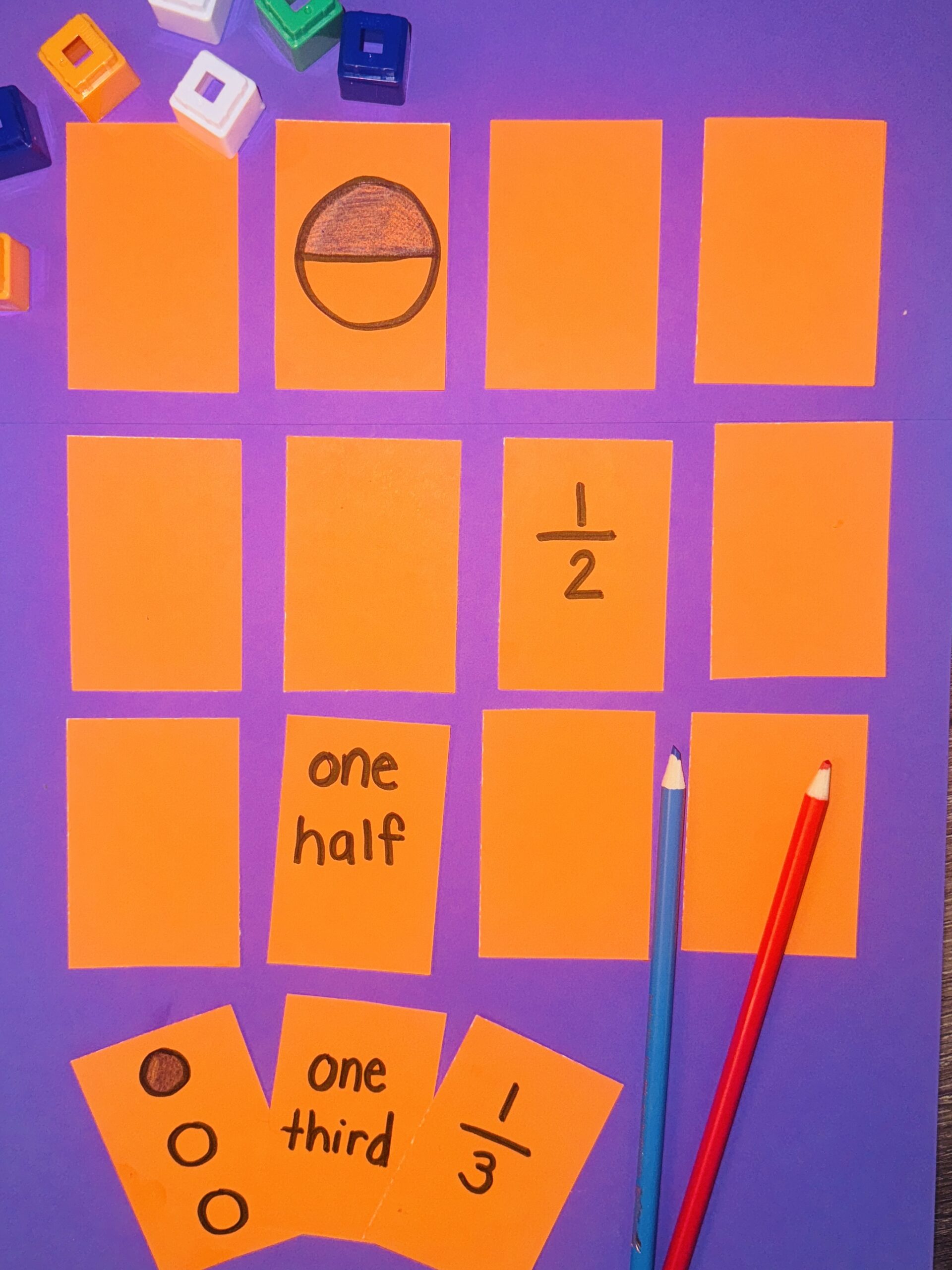 FractionWord-Picture-Number2 Orange cards with fractions written on some of them