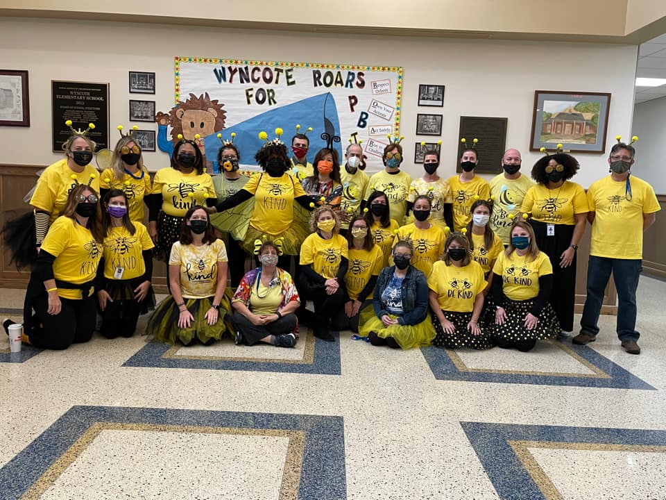 Group of teachers dressed as bees to represent Bee Kind