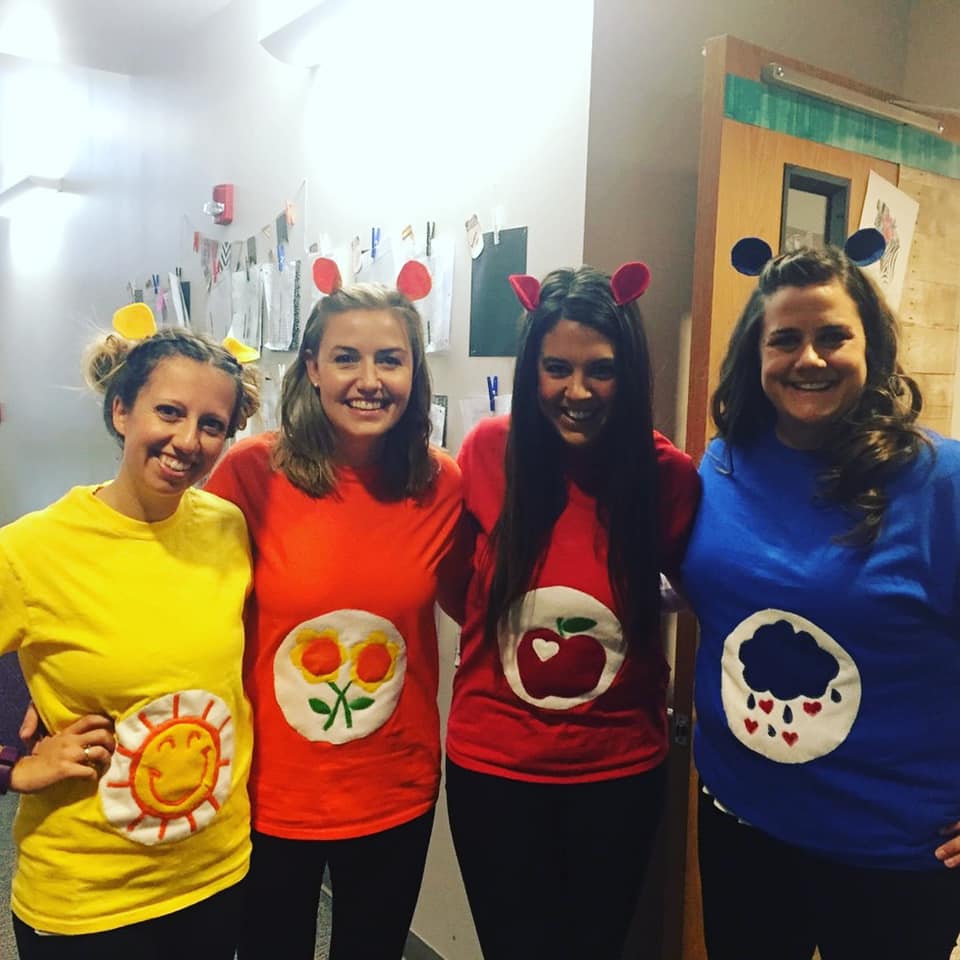 Teachers dressed as a group of Care Bears