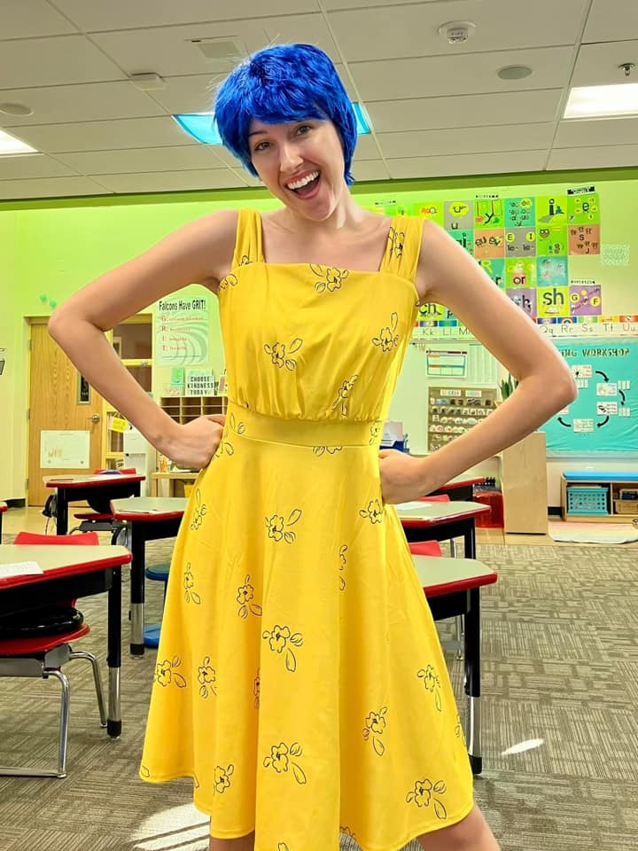 Teacher dressed as the character Joy from Inside Out