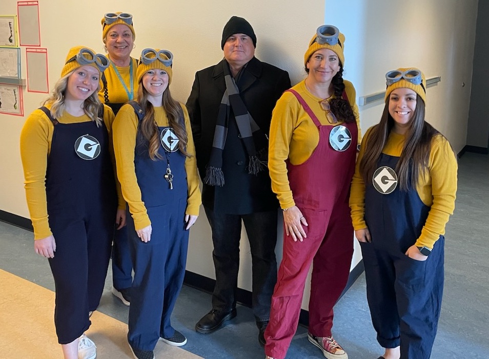 Group of teachers dressed as Minions and Gru