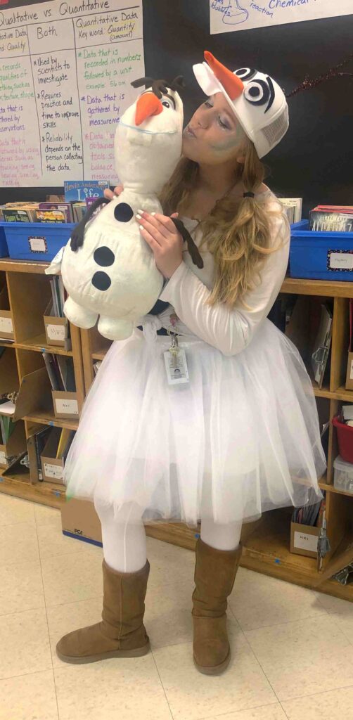 Teacher dressed as Olaf from the movie Frozen for Halloween