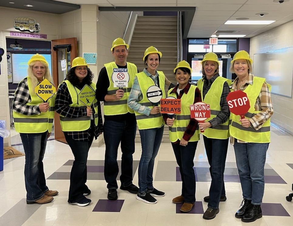 Group of teachers dressed as traffic control workers