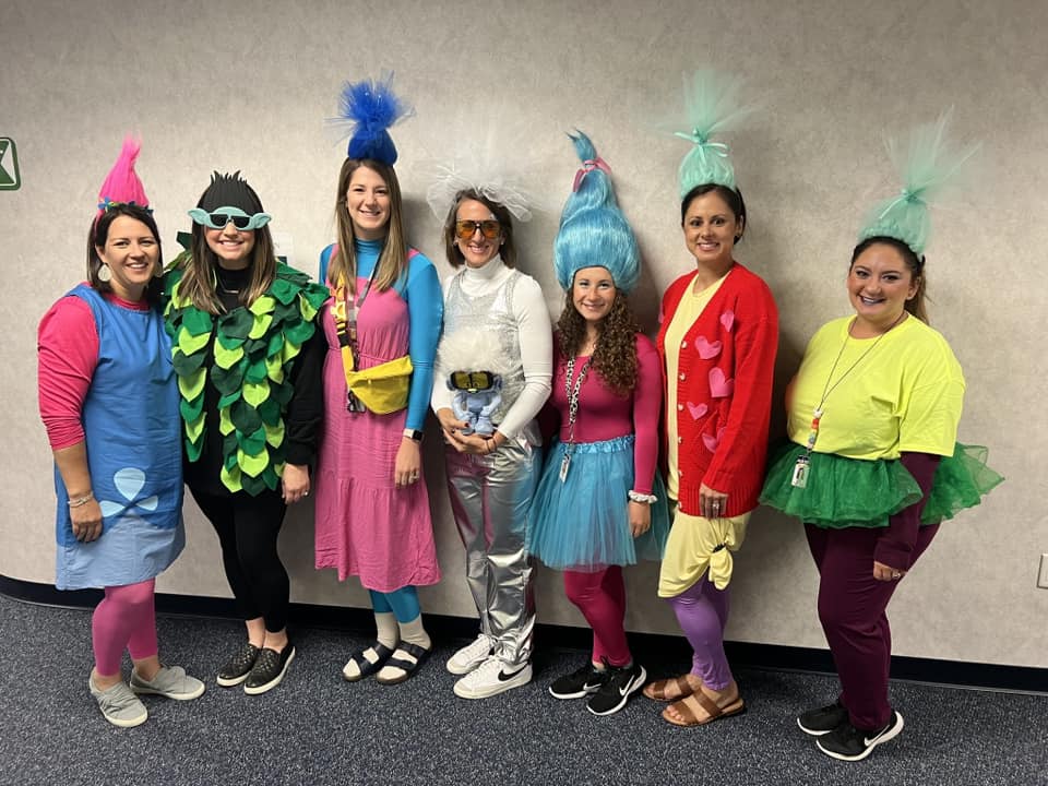 Group of teachers dressed as colorful troll dolls