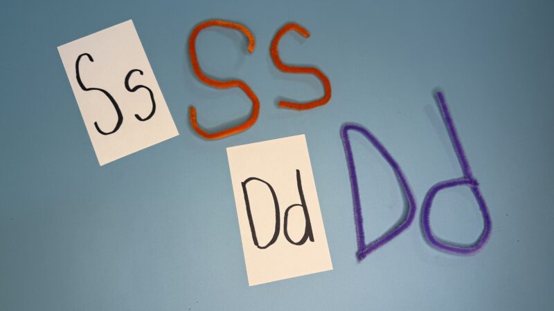 Letters of the alphabet bent with colorful pipe cleaners