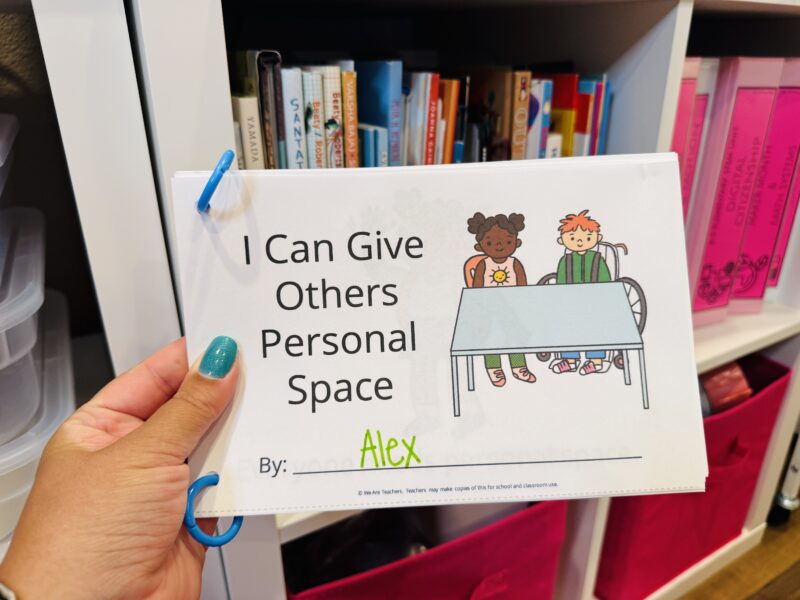 social-emotional learning activities social stories mini book printable that teacher is holding