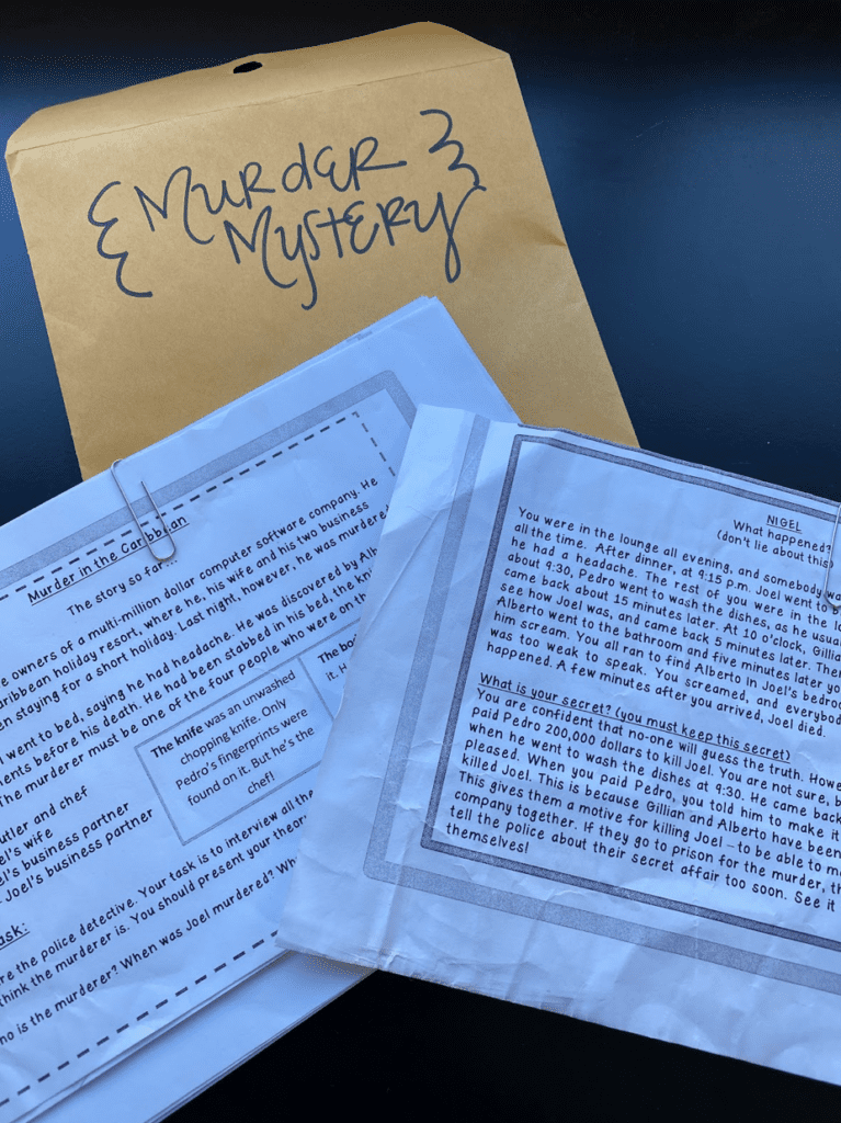 Murder Mystery Envelope with words murder mystery and papers