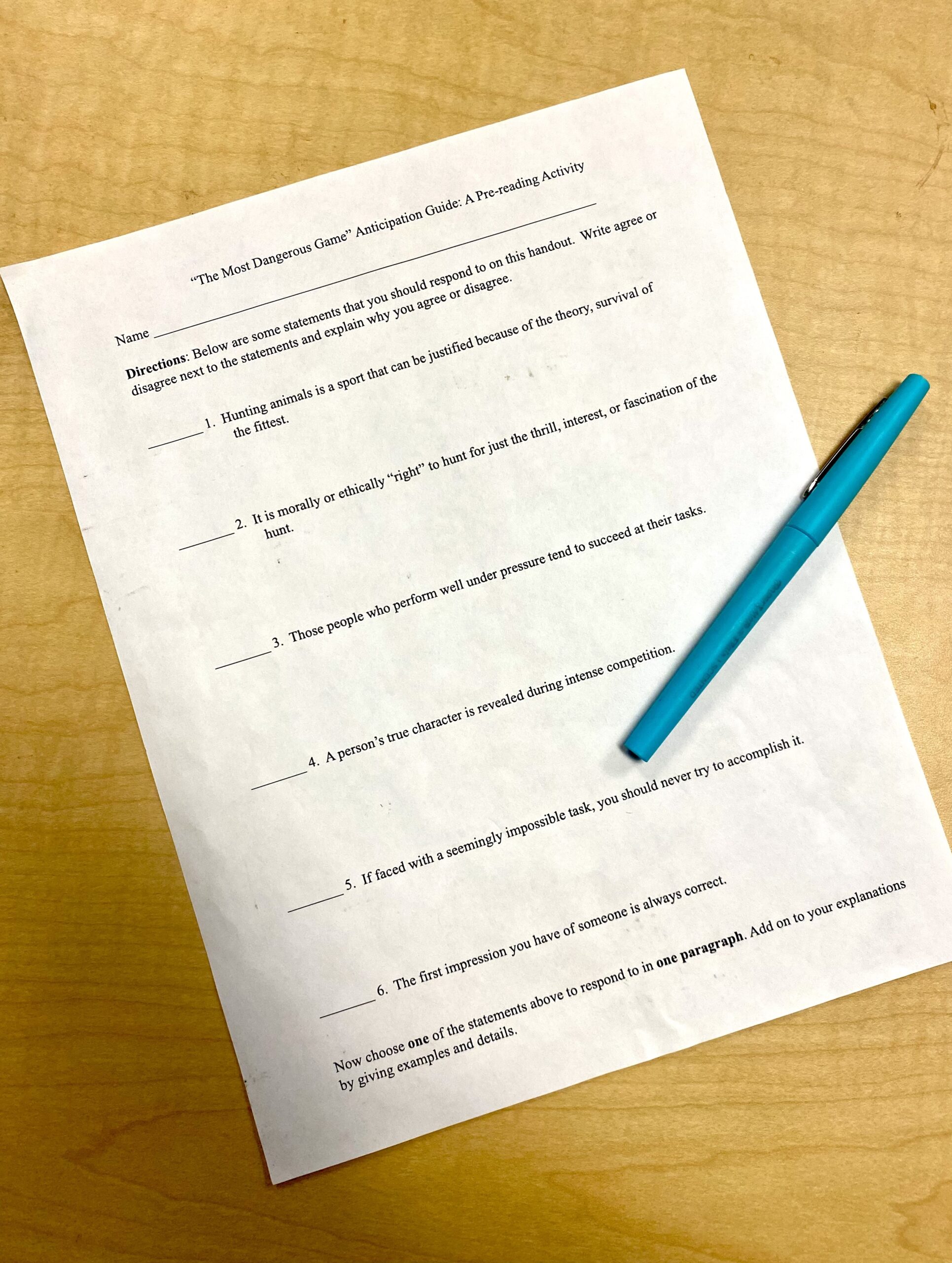 Anticipation Guide Anticipation Guide worksheet on desk with blue pen.