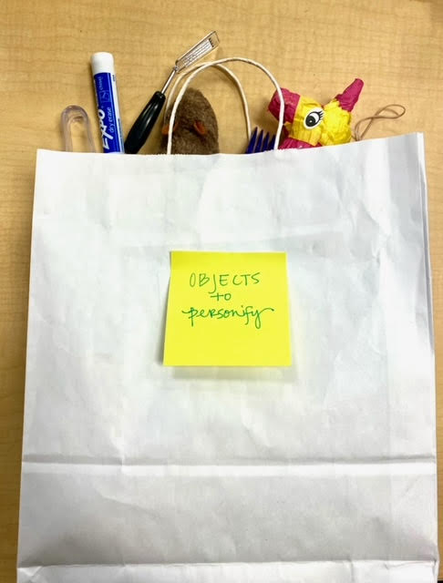 Bag of Objects for Personification White paper bag filled with objects to describe with personifcation.