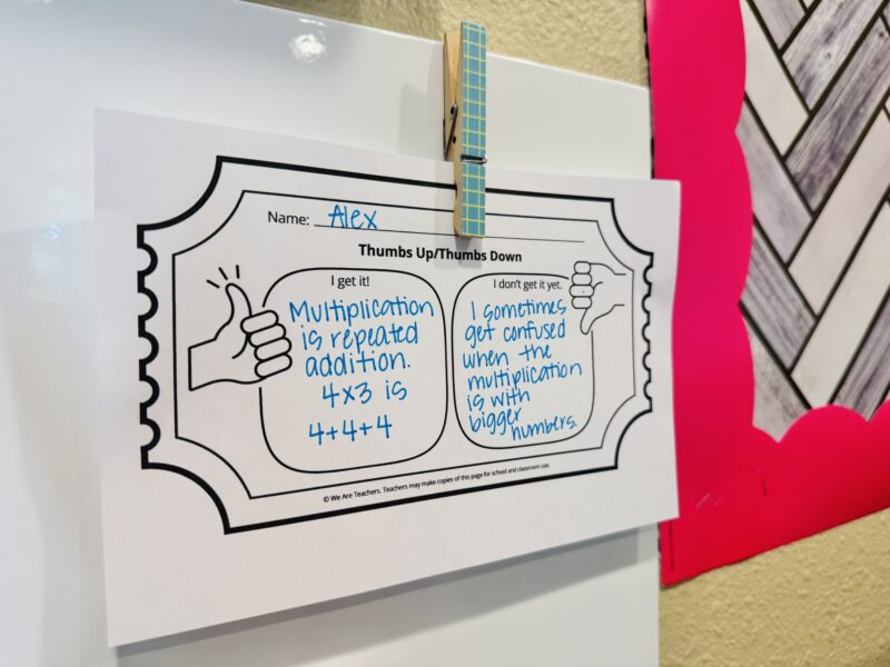 Thumbs Up Thumbs Down Exit Ticket for Growth Mindset Activities a thumbs up and thumbs down exit ticket hung up on a classroom whiteboard