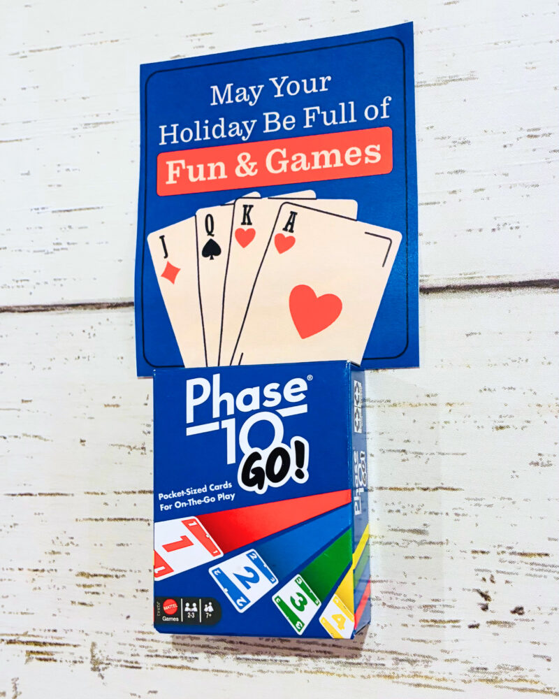 Holiday Gift Tags From Teachers holiday gift tag example for a student gift that says may your holiday be full of fun and games with a small pack of phase 10 cards