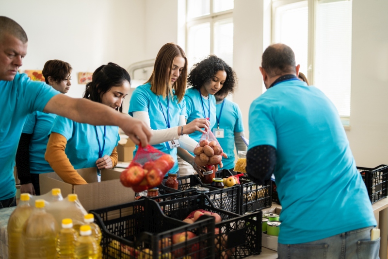 Service Learning Projects: Food Pantry Students and adults volunteering in a food pantry