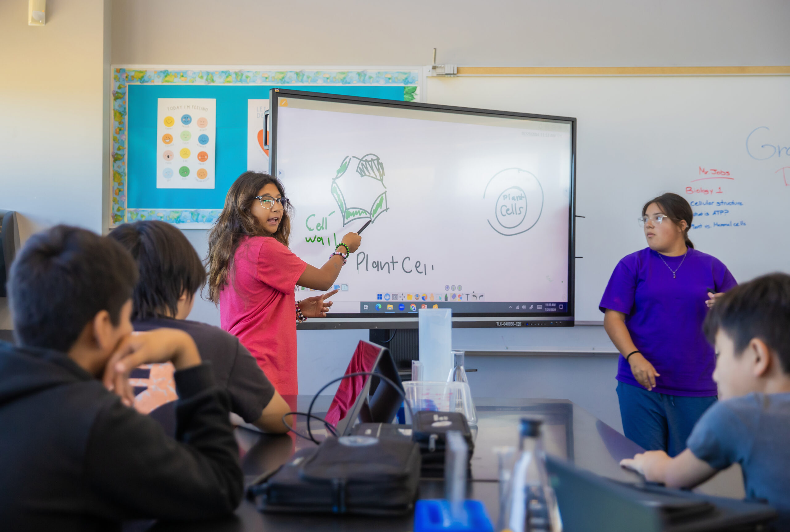 9 Ways to Level Up Your Classroom Tech With MyViewBoard® Image of a student using a myViewBoard in class